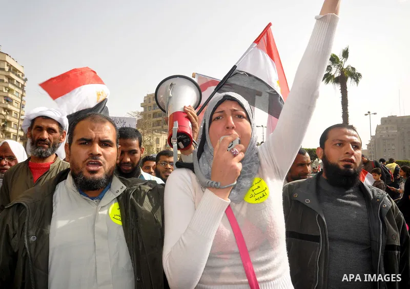 Egyptian protesters take part in a demonstration and Friday prayers in Tahrir Square, Cairo, Egypt, Friday, Feb. 25, 2011. Tens of thousands rallied in Cairo's Tahrir Square on Friday, trying to keep up pressure on Egypt...