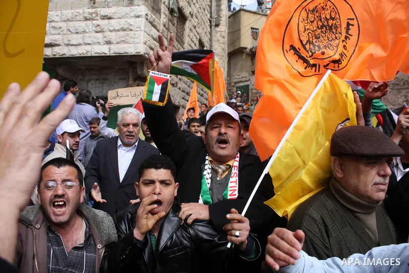 Palestinian, Israeli and foreign activists take part in a protest against the continued closure of Shuhada street to Palestinians, in the West Bank city of Hebron 25 February 2011. The activists gathered on Friday callin...