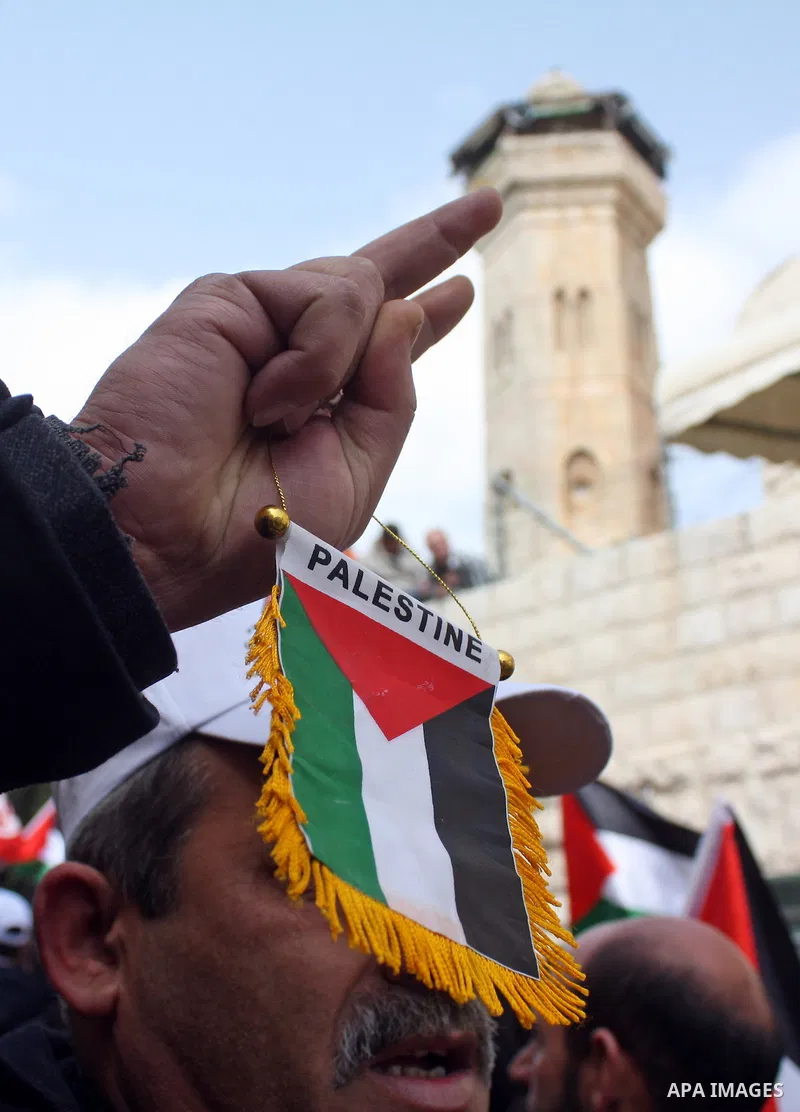 Palestinian, Israeli and foreign activists take part in a protest against the continued closure of Shuhada street to Palestinians, in the West Bank city of Hebron 25 February 2011. The activists gathered on Friday callin...