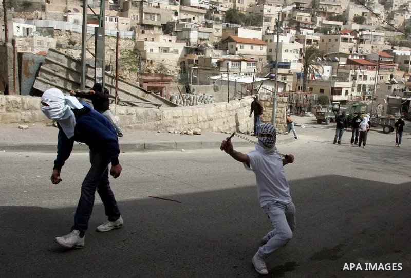 Palestinian youth throwers and Israeli forces clash in the mostly Arab east Jerusalem neighbourhood of Silwan on Feb 25, 2011. Photo by Mahfuz Abu Turk