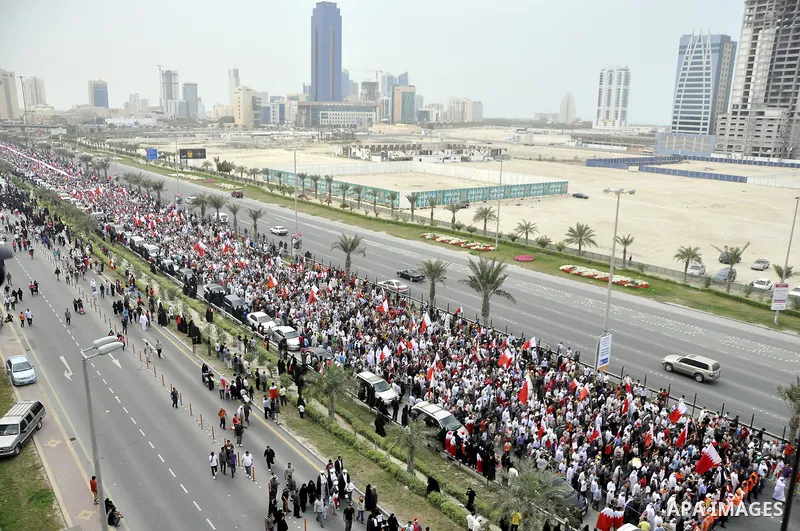 Protesters march on the streets of Manama, Bahrain, 25 February 2011. Tens of thousands of protesters marched in the Bahraini capital of Manama on 25 February to demand the resignation of the cabinet. It was the latest i...
