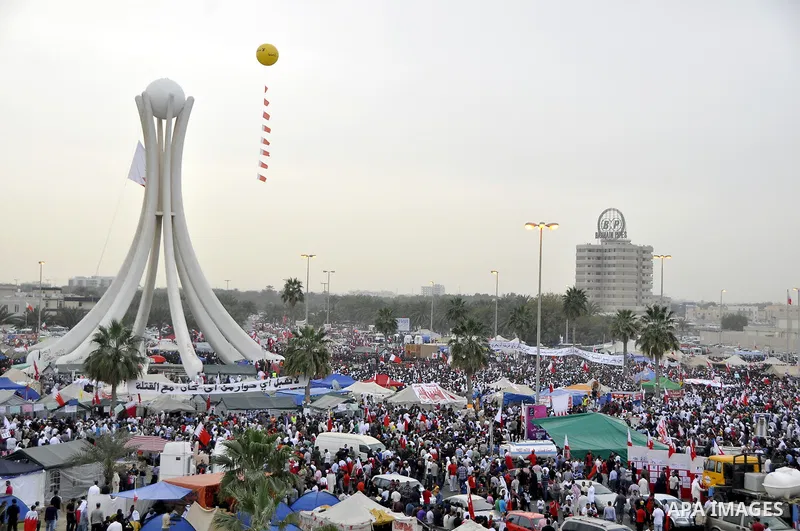 Protesters march on the streets of Manama, Bahrain, 25 February 2011. Tens of thousands of protesters marched in the Bahraini capital of Manama on 25 February to demand the resignation of the cabinet. It was the latest i...