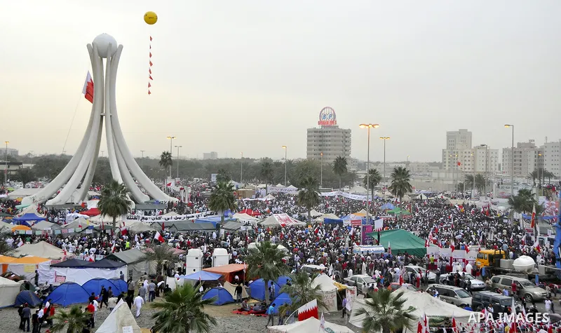 Protesters march on the streets of Manama, Bahrain, 25 February 2011. Tens of thousands of protesters marched in the Bahraini capital of Manama on 25 February to demand the resignation of the cabinet. It was the latest i...