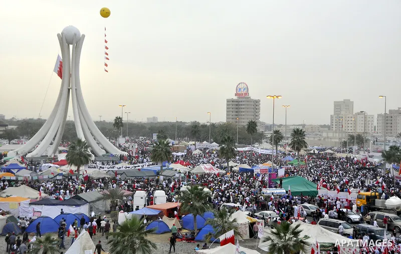 Protesters march on the streets of Manama, Bahrain, 25 February 2011. Tens of thousands of protesters marched in the Bahraini capital of Manama on 25 February to demand the resignation of the cabinet. It was the latest i...