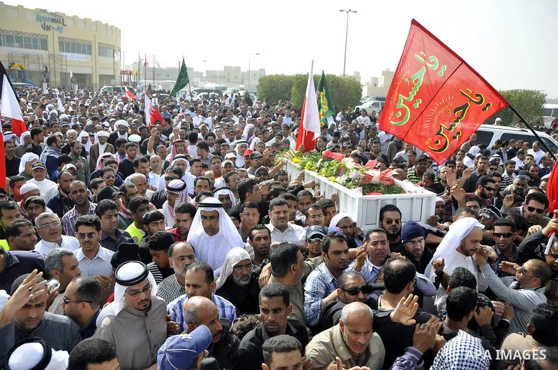 Anti-monarchy protesters and relatives accompany the coffin with the corpse of protester Abdul Redha Mohammed Hassan, 32, who was shot in the head by security forces while trying to march to Pearl Square, during the buri...