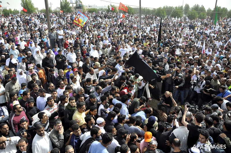 Anti-monarchy protesters and relatives accompany the coffin with the corpse of protester Abdul Redha Mohammed Hassan, 32, who was shot in the head by security forces while trying to march to Pearl Square, during the buri...