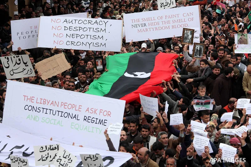 Libyan protesters demonstrate against Libyan leader Moammar Gadhafi during a rally at the Court Square in Derna, Libya, on Feb. 25, 2011. Photo by Karam Nasser