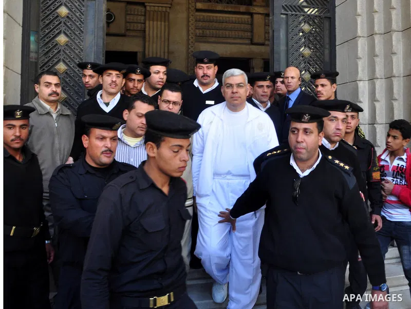 Amr Assal, (C), the former head of industrial authority wears white prison uniform as he walks out of Cairo Criminal Court in Cairo, Egypt, Saturday, Feb. 26, 2011. Photo by Ahmed Asad