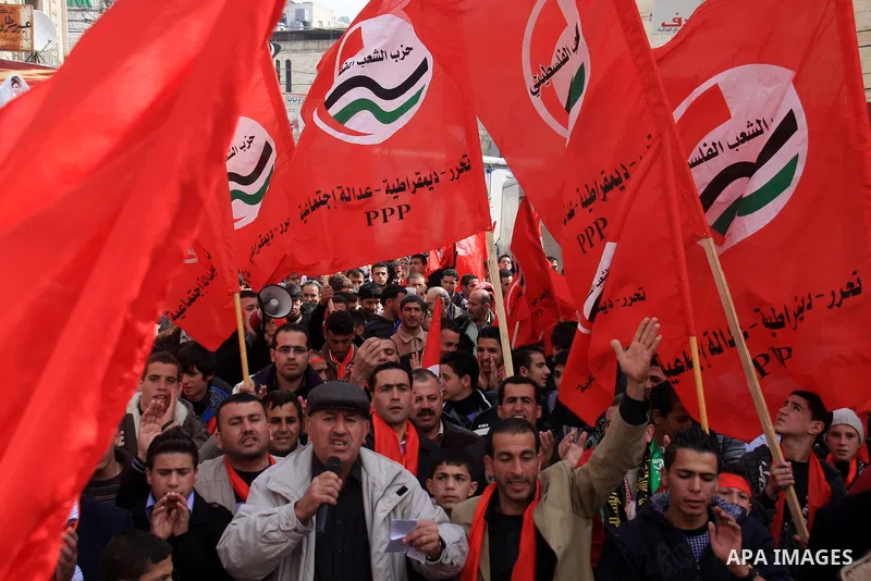 Palestinian supporters of the Palestinian Peoples Party (PPP) shout slogans during a rally in the centre of the West Bank city of Nablus demanding an end to the split between the Gaza Strip and the West Bank and calling...