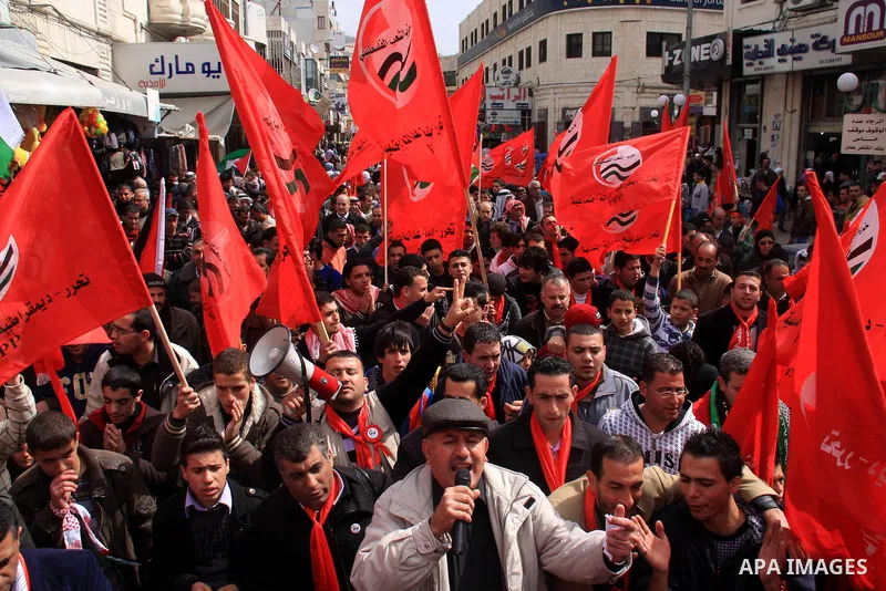 Palestinian supporters of the Palestinian Peoples Party (PPP) shout slogans during a rally in the centre of the West Bank city of Nablus demanding an end to the split between the Gaza Strip and the West Bank and calling...