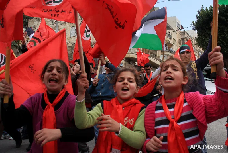 Palestinian supporters of the Palestinian Peoples Party (PPP) shout slogans during a rally in the centre of the West Bank city of Nablus demanding an end to the split between the Gaza Strip and the West Bank and calling...