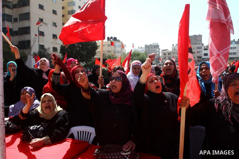 Palestinian supporters of the Democratic Front for the Liberation of Palestine (DFLP) shout slogans calling for the national unity during a rally marking the 42nd anniversary of the group's founding, in Gaza City, on Feb...