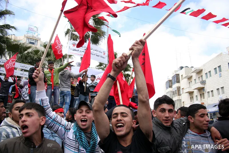 Palestinian supporters of the Democratic Front for the Liberation of Palestine (DFLP) carry flags during a rally celebrating 42 years since its founding in the West Bank city of Ramallah, Saturday, Feb. 26, 2011. Founded...