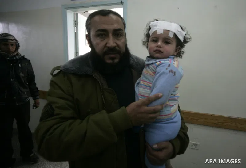 A Palestinian girl cries as she receives a treatment after she was wounded in Israeli air raid, at a hospital in the southern Gaza Strip town of Rafah, on Feb. 26, 2011. Israeli aircraft attacked two military sites of th...