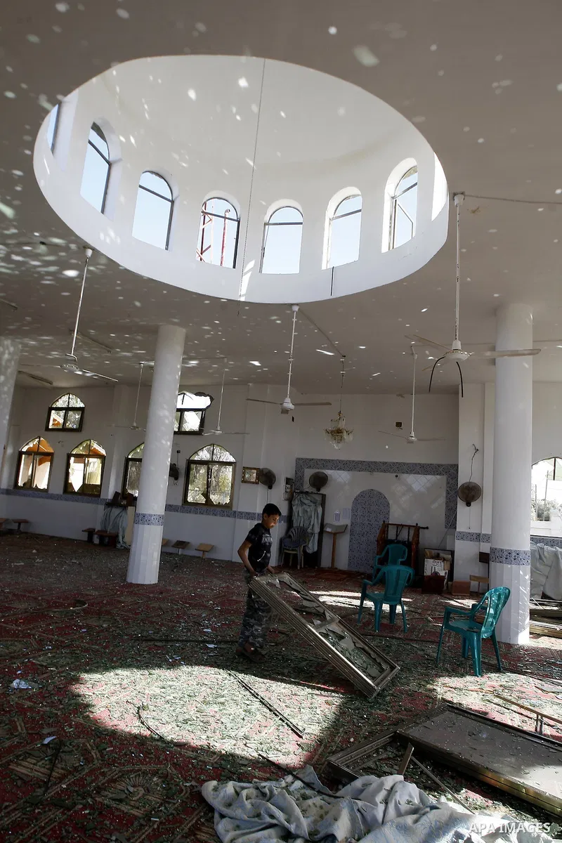 Palestinians inspect the damage to a mosque at the scene of an Israeli air strike in Rafah, southern Gaza Strip on February 26, 2011. Israeli warplanes bombed two training camps of the Islamic Jihad group in the Gaza Str...
