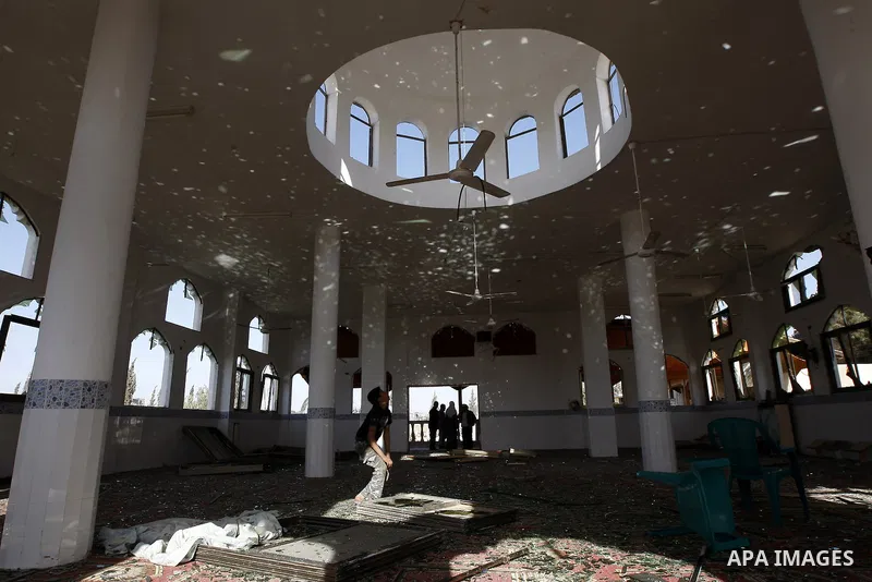 Palestinians inspect the damage to a mosque at the scene of an Israeli air strike in Rafah, southern Gaza Strip on February 26, 2011. Israeli warplanes bombed two training camps of the Islamic Jihad group in the Gaza Str...