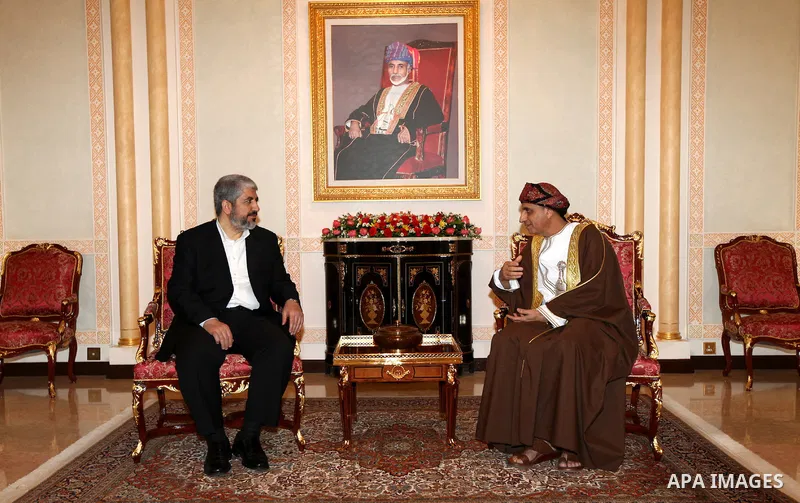 Palestinian Hamas leader Khaled Meshaal, (L), during a meeting the deputy prime minister of the Sultanate of Oman, Fahd bin Mahmoud al Said, (R), in Sultanate of Oman on Feb. 26, 2011. Photo by Majd Majd
