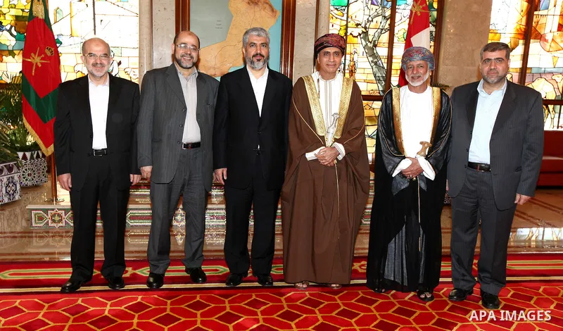 A picture shows members of the Hamas delegation during their visit to Sultanate of Oman on Feb. 26, 2011, Hamas politburo member Mohamed Nasr (R), Omani Minister of Foreign Affairs Yousuf bin Alawi bin Abdullah (2-R), De...