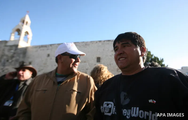 Chilean miners who were rescued after 69 days of trapping underground in a collapsed mine in San Jose, visit the Church of the Nativity, the site revered as the birthplace of Jesus, in the West Bank city of Bethlehem, on...