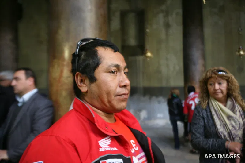 A member of Chilean miners who were rescued after 69 days of trapping underground in a collapsed mine in San Jose, visits the Church of the Nativity, the site revered as the birthplace of Jesus, in the West Bank city of...