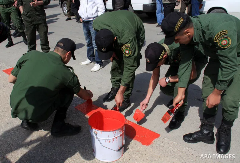 Palestinian national security forces paint the streets in the center of the city of Nablus in the West Bank, Sunday, Feb. 27, 2011. Photo by Wagdi Eshtayah