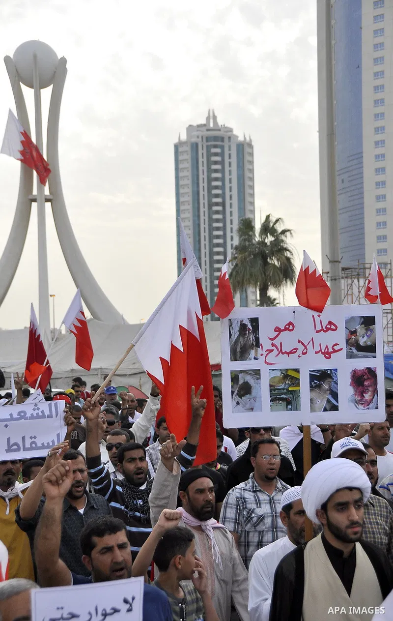 Bahraini Shiite anti-government protesters demonstrate in the streets of Manama on February 27, 2011. Eighteen Bahraini MPs from Al-Wefaq Shiite opposition bloc officially submitted their letter of resignation to protest...