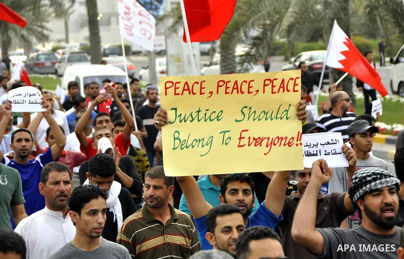 Bahraini Shiite anti-government protesters demonstrate in the streets of Manama on February 27, 2011. Eighteen Bahraini MPs from Al-Wefaq Shiite opposition bloc officially submitted their letter of resignation to protest...