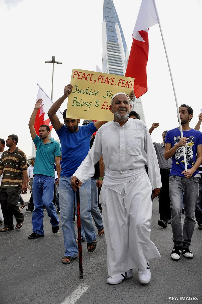 Bahraini Shiite anti-government protesters demonstrate in the streets of Manama on February 27, 2011. Eighteen Bahraini MPs from Al-Wefaq Shiite opposition bloc officially submitted their letter of resignation to protest...