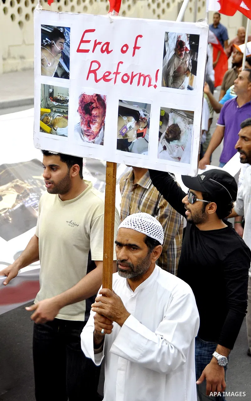 Bahraini Shiite anti-government protesters demonstrate in the streets of Manama on February 27, 2011. Eighteen Bahraini MPs from Al-Wefaq Shiite opposition bloc officially submitted their letter of resignation to protest...