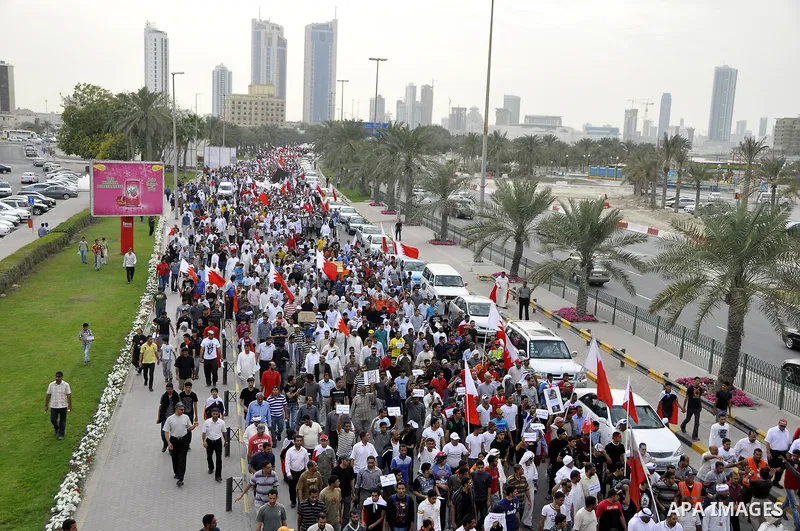 Bahraini Shiite anti-government protesters demonstrate in the streets of Manama on February 27, 2011. Eighteen Bahraini MPs from Al-Wefaq Shiite opposition bloc officially submitted their letter of resignation to protest...