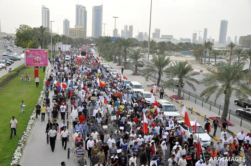 Bahraini Shiite anti-government protesters demonstrate in the streets of Manama on February 27, 2011. Eighteen Bahraini MPs from Al-Wefaq Shiite opposition bloc officially submitted their letter of resignation to protest...