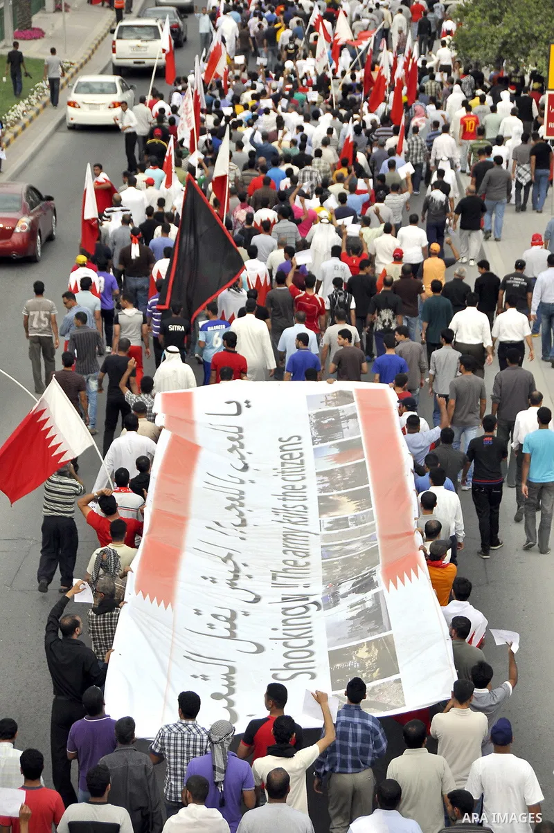 Bahraini Shiite anti-government protesters demonstrate in the streets of Manama on February 27, 2011. Eighteen Bahraini MPs from Al-Wefaq Shiite opposition bloc officially submitted their letter of resignation to protest...