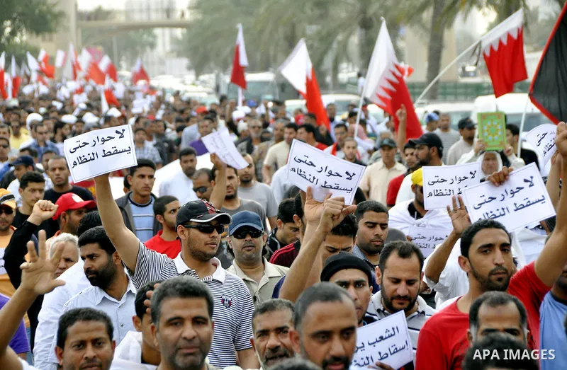 Bahraini Shiite anti-government protesters demonstrate in the streets of Manama on February 27, 2011. Eighteen Bahraini MPs from Al-Wefaq Shiite opposition bloc officially submitted their letter of resignation to protest...