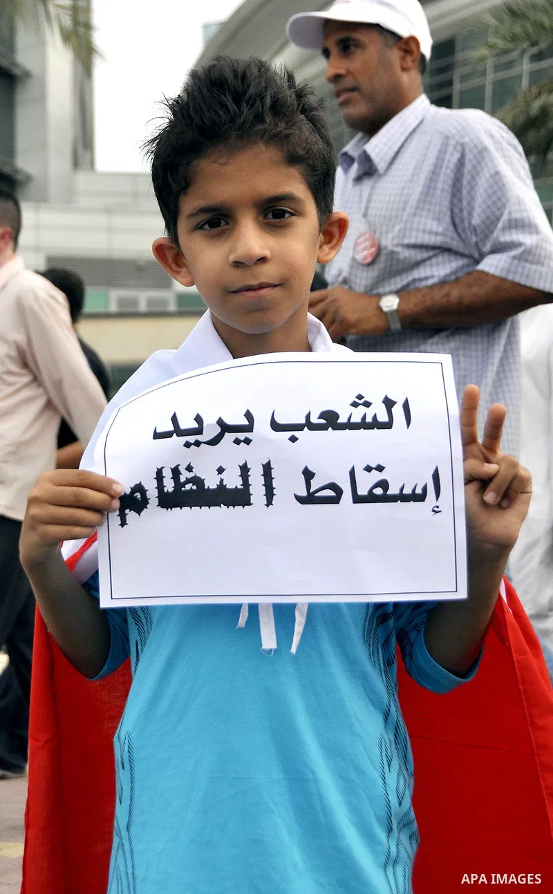 Bahraini Shiite anti-government protesters demonstrate in the streets of Manama on February 27, 2011. Eighteen Bahraini MPs from Al-Wefaq Shiite opposition bloc officially submitted their letter of resignation to protest...