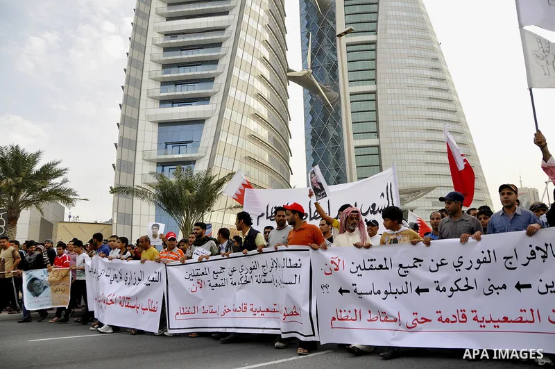 Bahraini Shiite anti-government protesters demonstrate in the streets of Manama on February 27, 2011. Eighteen Bahraini MPs from Al-Wefaq Shiite opposition bloc officially submitted their letter of resignation to protest...