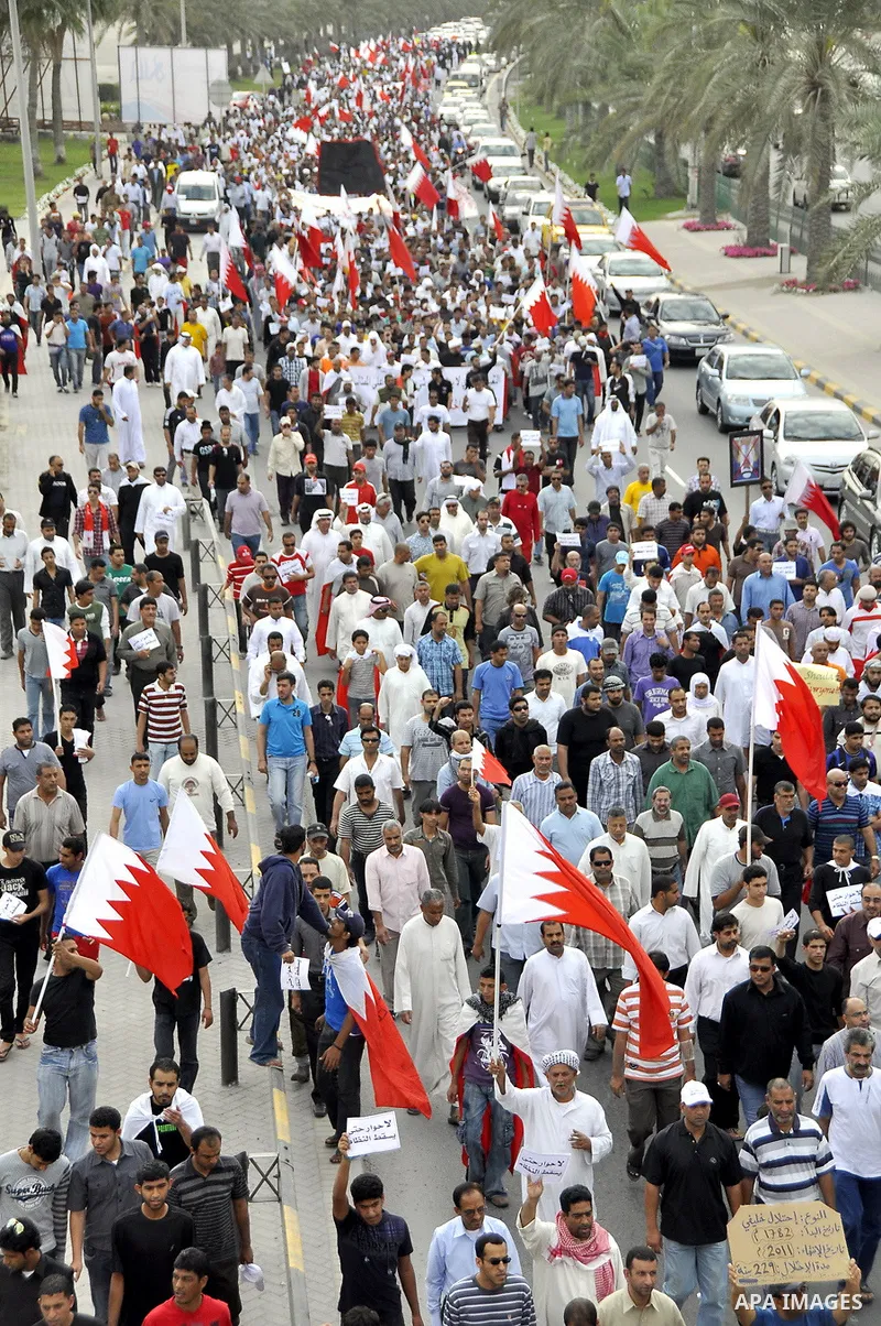 Bahraini Shiite anti-government protesters demonstrate in the streets of Manama on February 27, 2011. Eighteen Bahraini MPs from Al-Wefaq Shiite opposition bloc officially submitted their letter of resignation to protest...