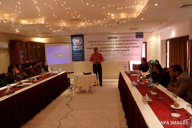 Palestinians attend a meeting to discuss the challenges for local media in producing humanitarian and recovery information for adults and children, in Gaza City on Feb. 28, 2011. Photo by Mohammed Asad