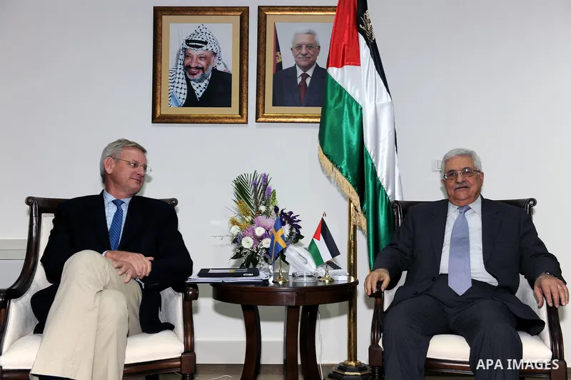 Palestinian president Mahmoud Abbas during a meeting with the Minister of Foreign Affairs of Sweden, Carl Bildt (L), in the West Bank city of Ramallah on Feb. 28, 2011. Photo by Omar Rashid