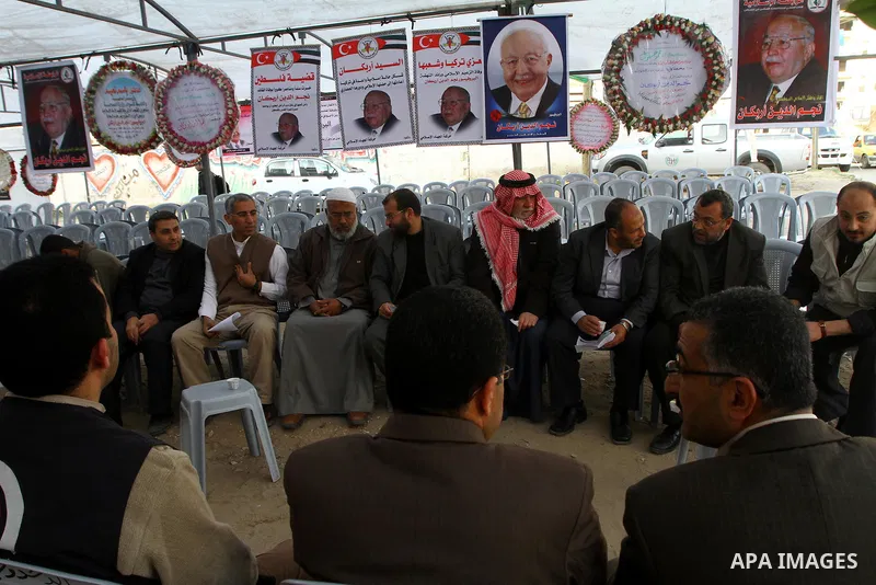 Palestinians offer the condolences on the death of the Turkish leader, Necmettin Erbakan in Gaza city on Feb. 28,2011. Photo by Ashraf Amra