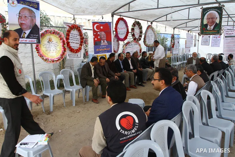 Palestinians offer the condolences on the death of the Turkish leader, Necmettin Erbakan in Gaza city on Feb. 28,2011. Photo by Ashraf Amra