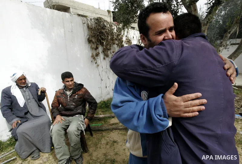 Palestinian prisoner Nabil Mansour al-Bashiti, 49 years, is welcomed by relatives after his arrival to his home in Khan Younis in the southern Gaza Strip on March 01, 2011. Egyptian authorities released al-Bashiti after...