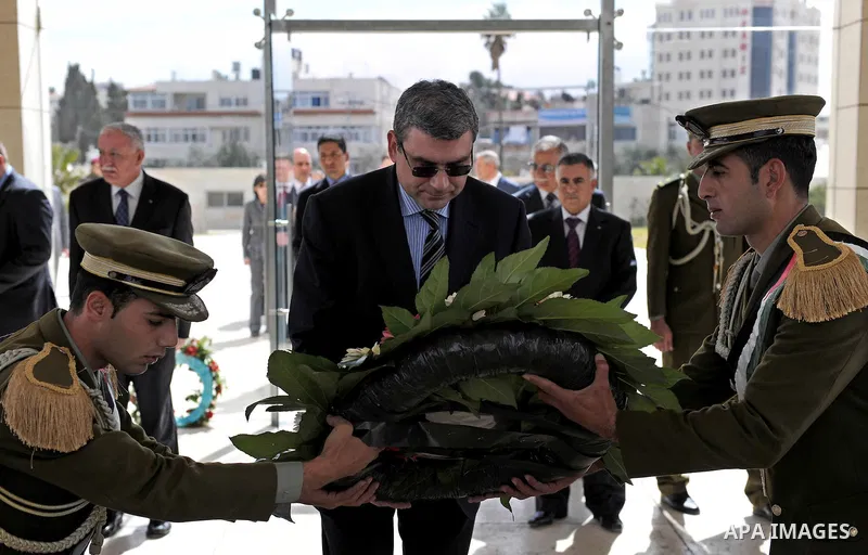 Romanian Foreign Minister, Teodor Baconschi places a wreath on the tomb of the late President Yasser Arafat in the West Bank city of Ramallah on March 1, 2011. Photo by Omar Rashidi