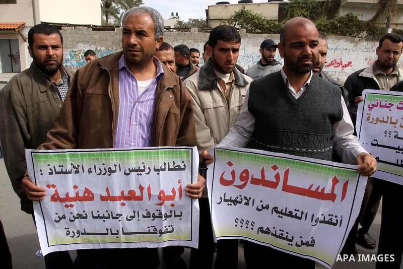 Palestinian teachers take part in a rally in front of the Palestinian Legislative Council headquarters calling the government for jobs in Gaza city on March 1,2011 . Photo by Mohammed Asad