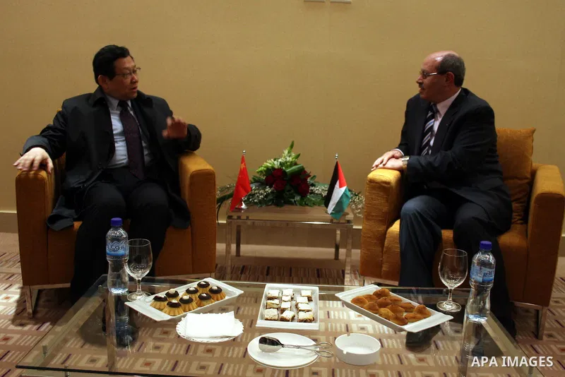 Palestinian Economy Minister, Hassan Abu Lebda meets with the Chinese Commerce Minister Chen Deming in the West Bank city of Ramallah on March 1, 2011. Photo by Issam Rimawi