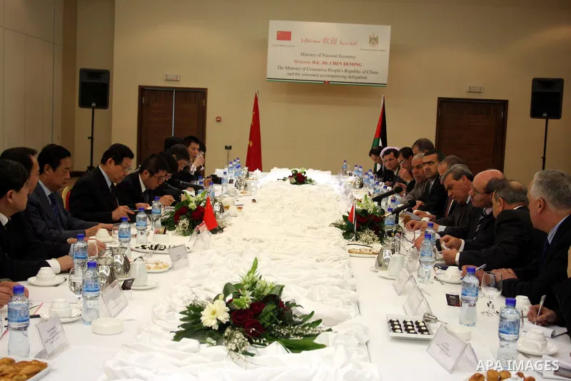 Palestinian Economy Minister, Hassan Abu Lebda meets with the Chinese Commerce Minister Chen Deming in the West Bank city of Ramallah on March 1, 2011. Photo by Issam Rimawi