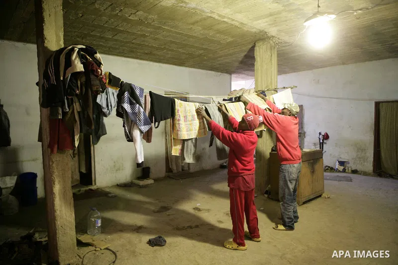 African migrant workers living in miserable conditions in Benghazi March 1, 2011. African workers fear attacks from Libyans hunting for alleged mercenary fighters. Wealthier Western and Asian states have sent ships to ev...