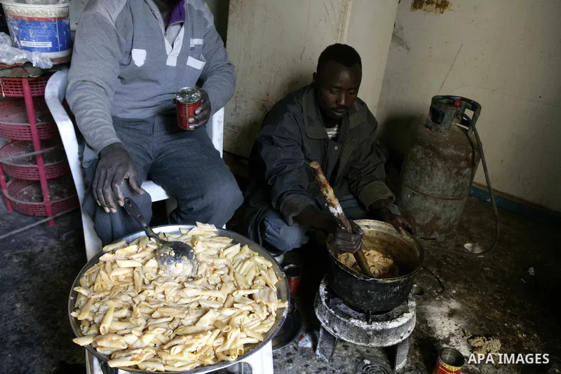 African migrant workers living in miserable conditions in Benghazi March 1, 2011. African workers fear attacks from Libyans hunting for alleged mercenary fighters. Wealthier Western and Asian states have sent ships to ev...