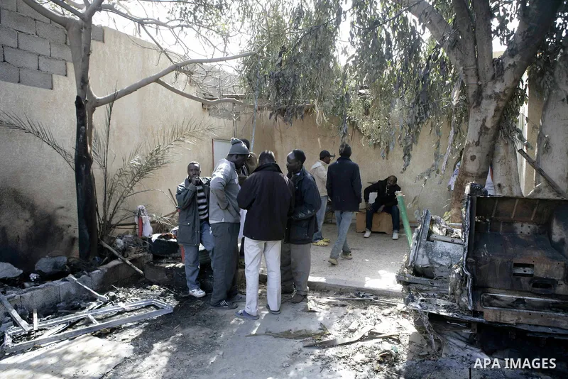 African migrant workers living in miserable conditions in Benghazi March 1, 2011. African workers fear attacks from Libyans hunting for alleged mercenary fighters. Wealthier Western and Asian states have sent ships to ev...