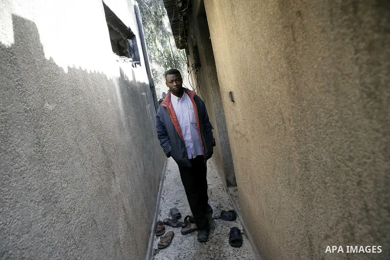 African migrant workers living in miserable conditions in Benghazi March 1, 2011. African workers fear attacks from Libyans hunting for alleged mercenary fighters. Wealthier Western and Asian states have sent ships to ev...