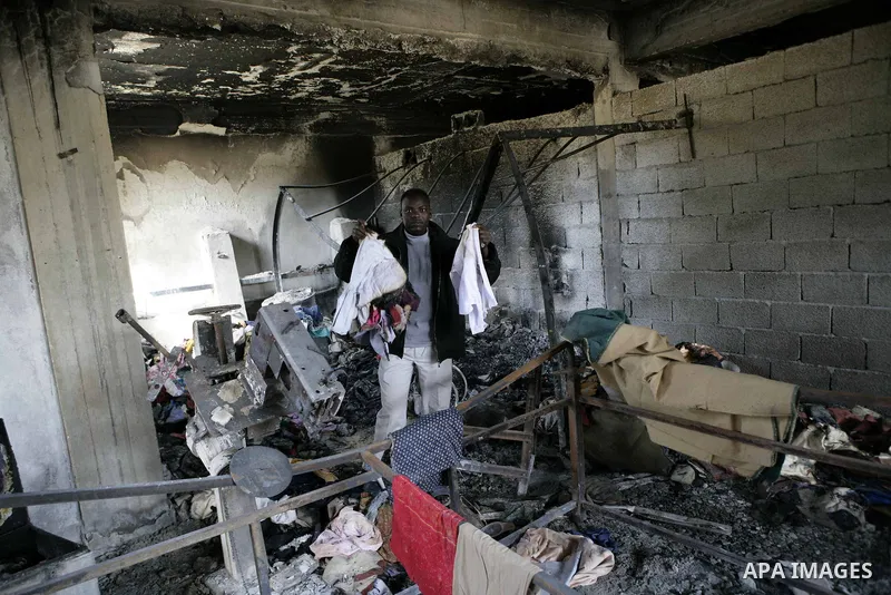 African migrant workers living in miserable conditions in Benghazi March 1, 2011. African workers fear attacks from Libyans hunting for alleged mercenary fighters. Wealthier Western and Asian states have sent ships to ev...
